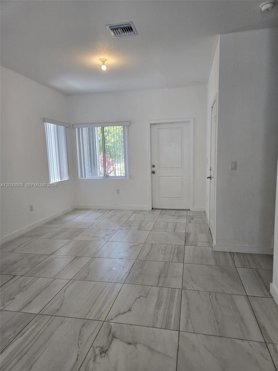 862 Southeast 17 Street, Unit 862 Homestead, FL 33034 - Photo 28 of 39 a view of an empty room with a window