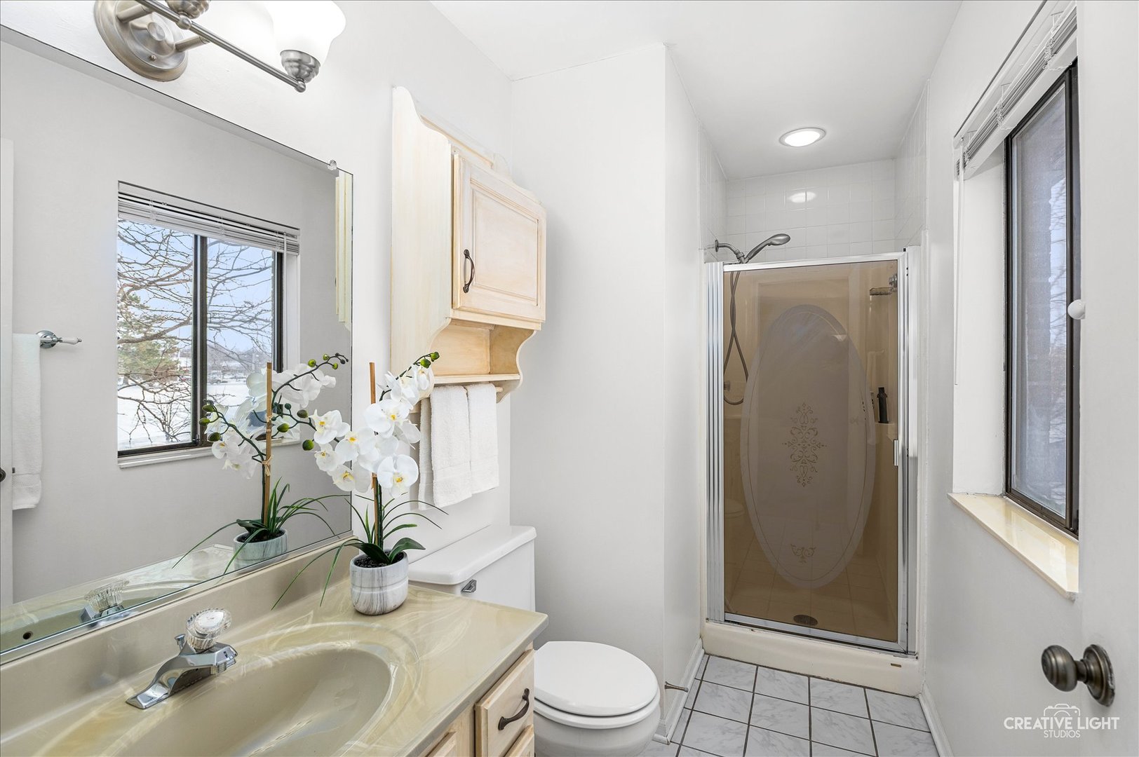 40 Harbor Court, Unit 304 Naperville, IL 60565 - Photo 11 of 18 a bathroom with a sink toilet and shower