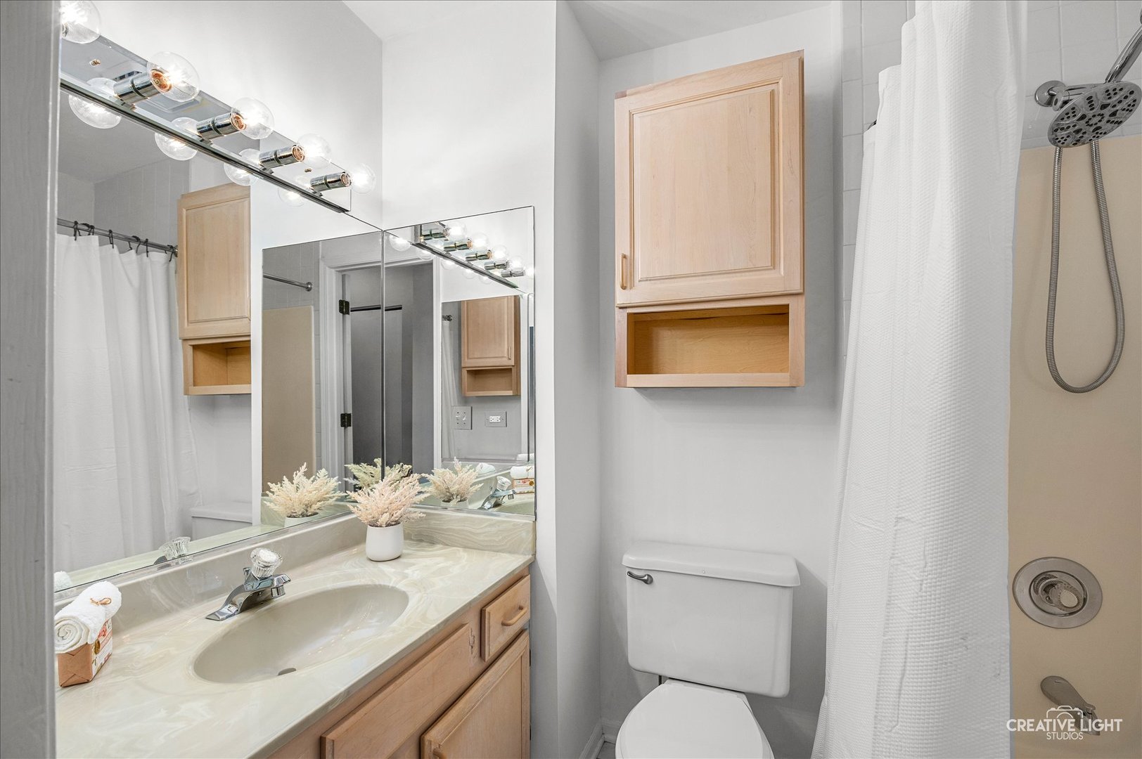 40 Harbor Court, Unit 304 Naperville, IL 60565 - Photo 13 of 18 a bathroom with a sink toilet and shower