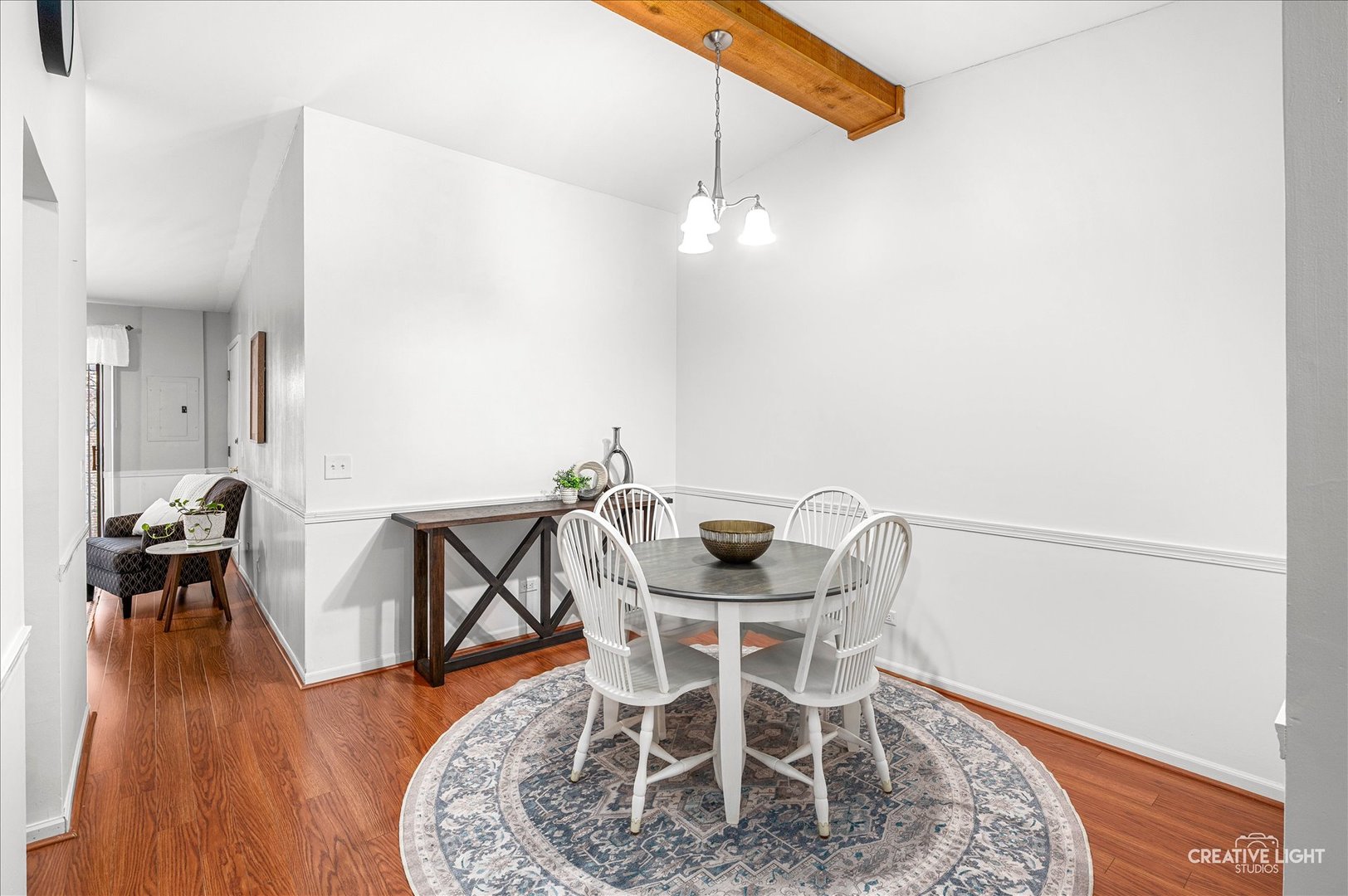 40 Harbor Court, Unit 304 Naperville, IL 60565 - Photo 4 of 18 a view of a dining room with furniture and wooden floor