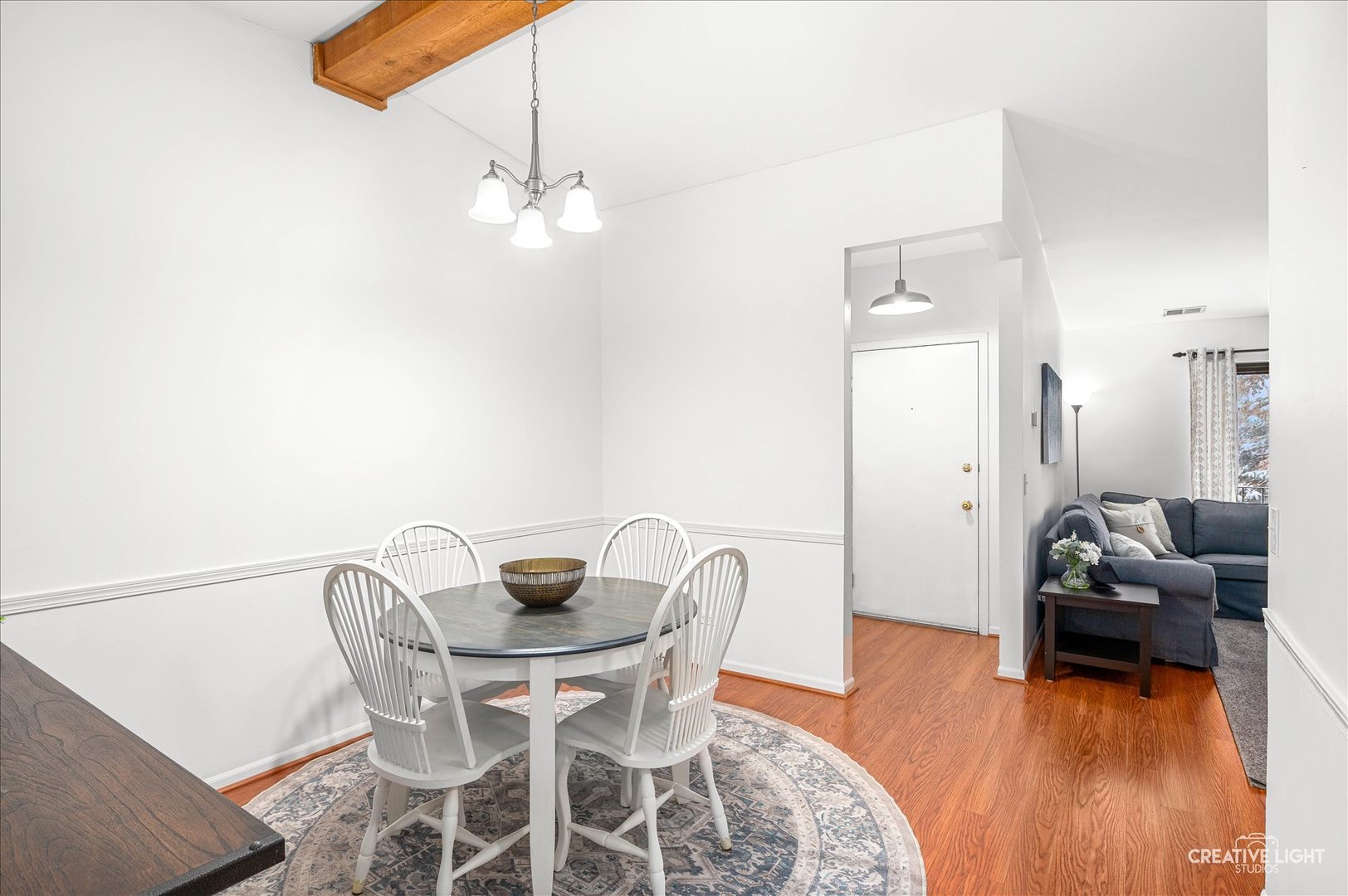 40 Harbor Court, Unit 304 Naperville, IL 60565 - Photo 5 of 18 a view of a dining room with furniture and wooden floor