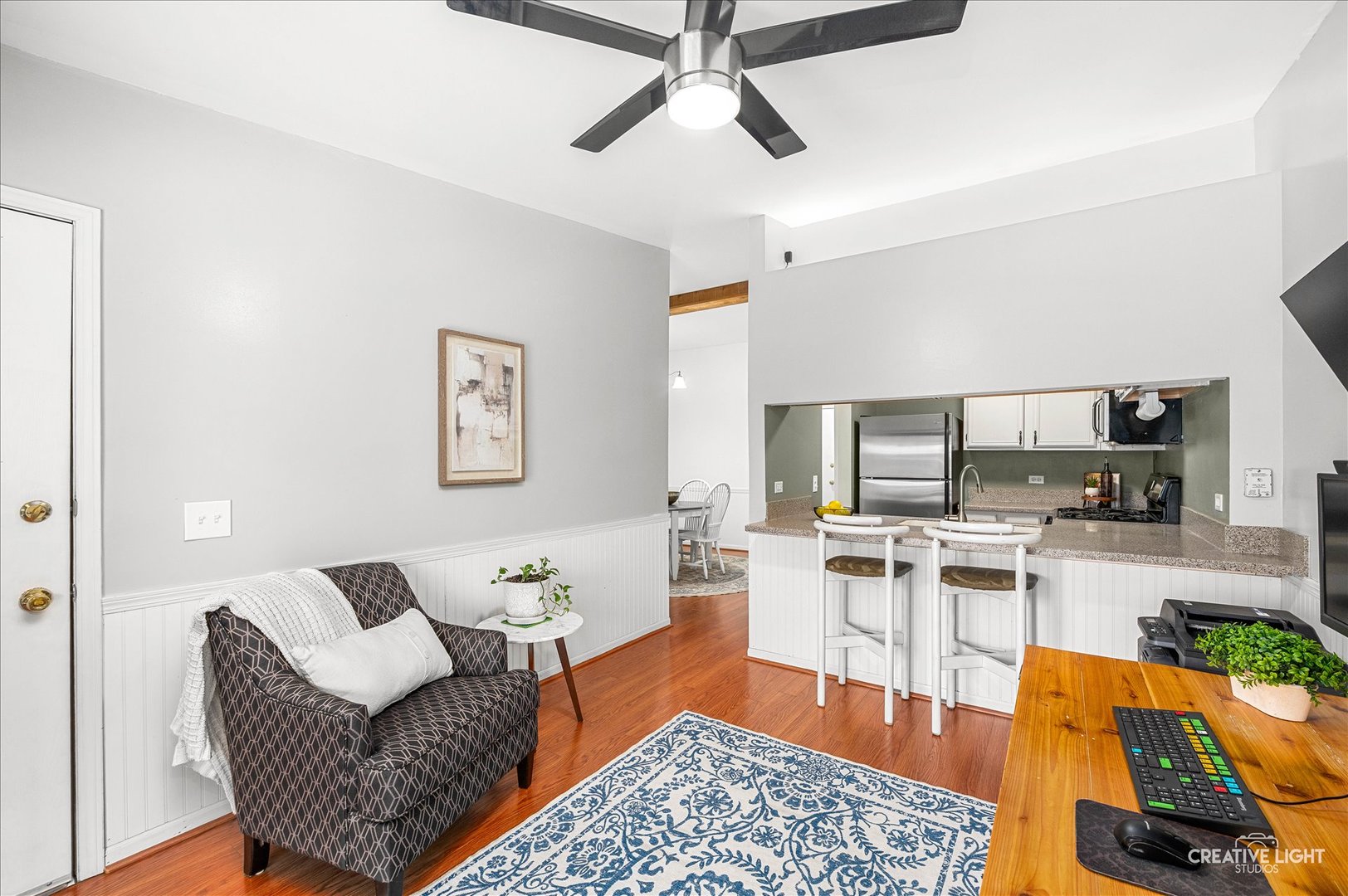 40 Harbor Court, Unit 304 Naperville, IL 60565 - Photo 8 of 18 a living room with furniture and a flat screen tv