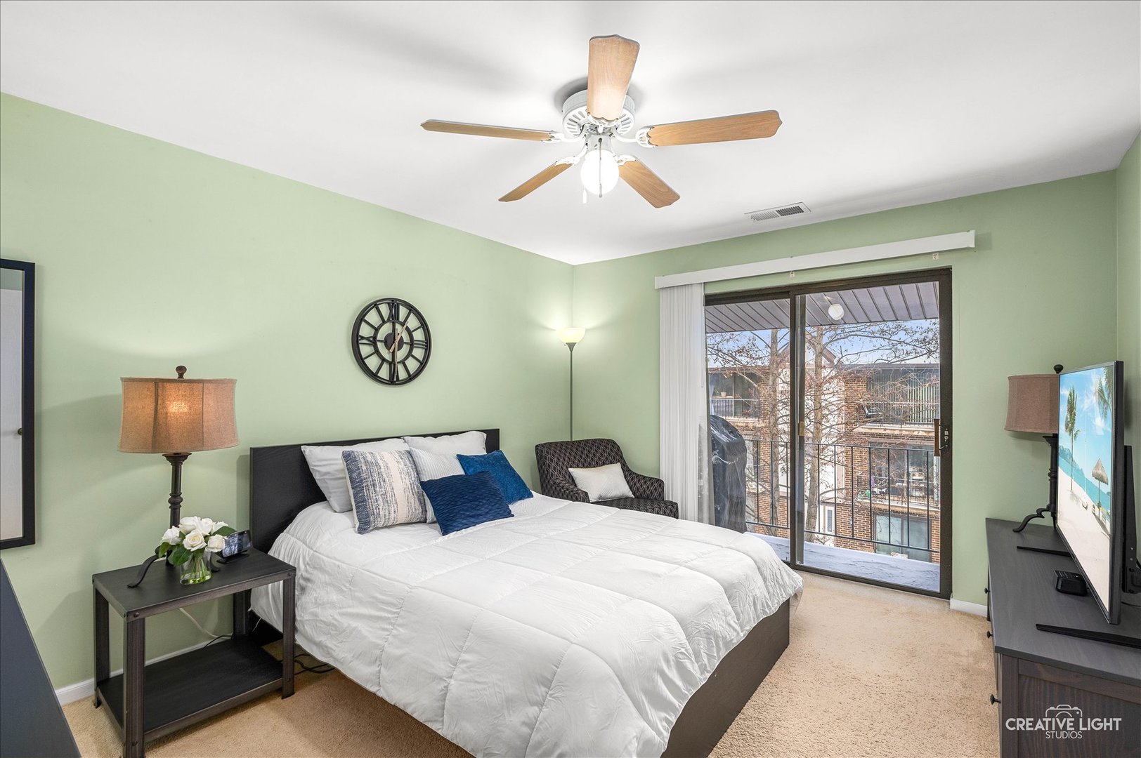 40 Harbor Court, Unit 304 Naperville, IL 60565 - Photo 10 of 18 a bedroom with a bed and a flat tv screen on dresser