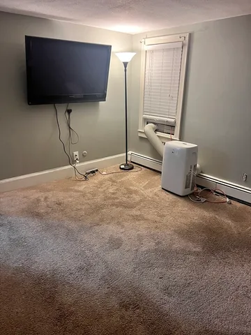 a view of a room with a flat screen tv