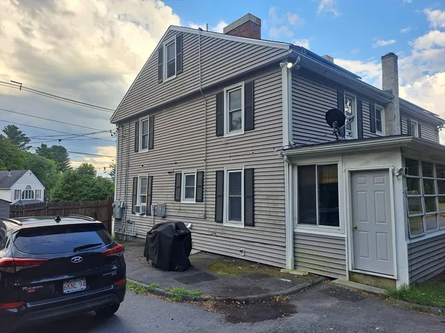 a front view of a house with parking space