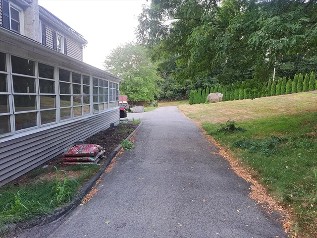 a view of a backyard with sitting area