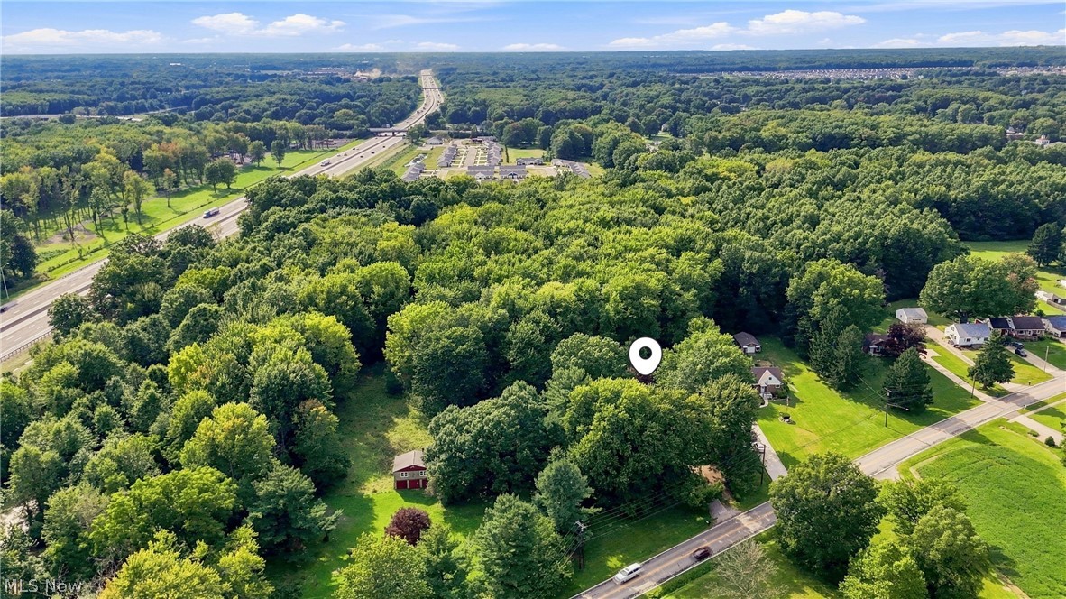 7524 Root Road North Ridgeville, OH 44039 - Photo 49 of 50 Expansive wooded parcel with a clear lot, established roadways, and a distant highway