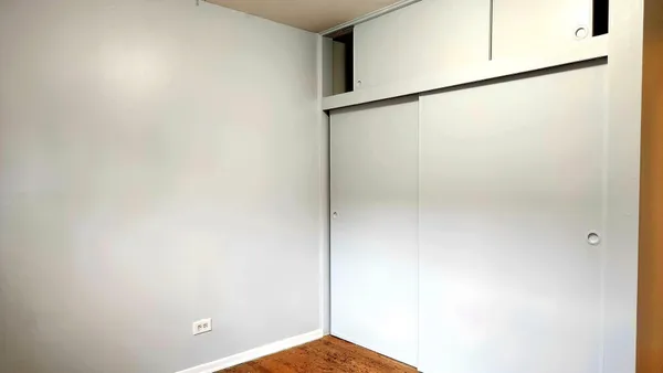 a view of wooden floor and cabinet