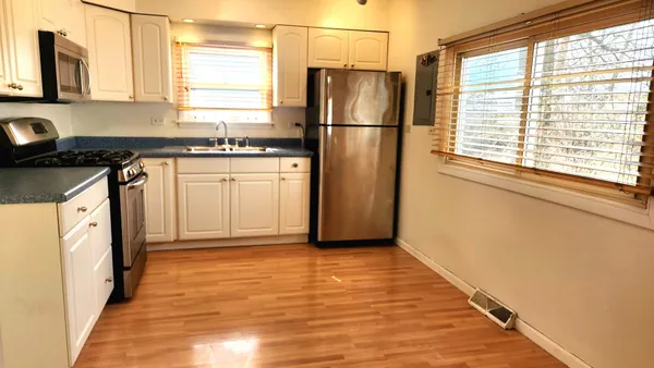 a view of a storage and utility room with washer and dryer