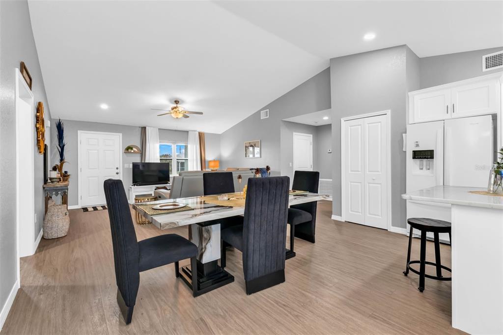11615 Southwest Orange Avenue Arcadia, FL 34269 - Photo 13 of 27 a view of a dining room with furniture and wooden floor