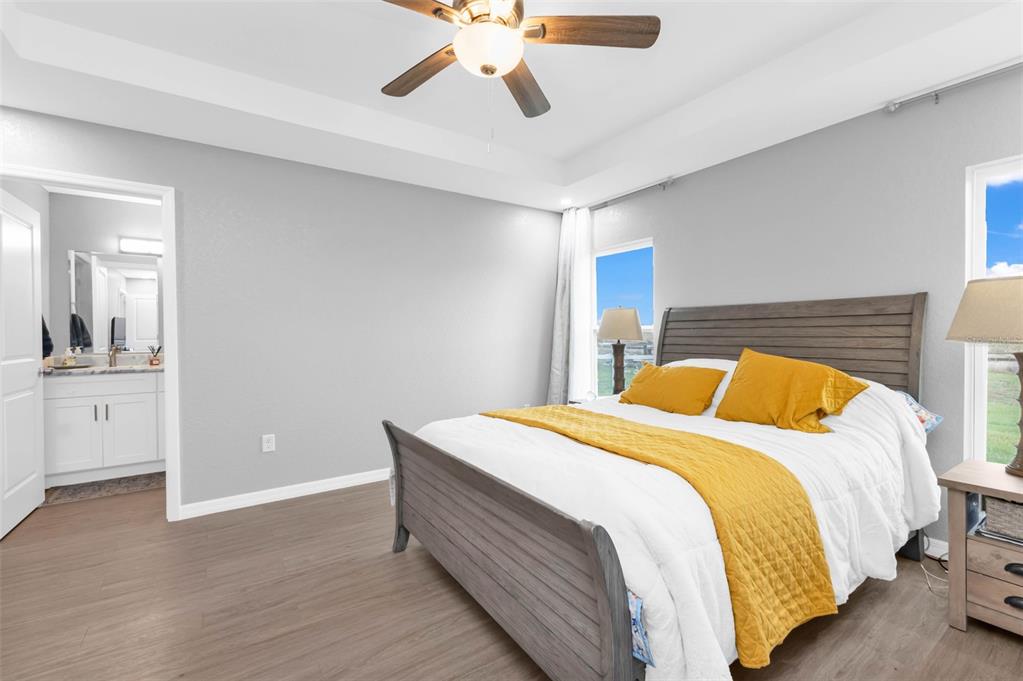 11615 Southwest Orange Avenue Arcadia, FL 34269 - Photo 14 of 27 a bed room with a bed and a chandelier