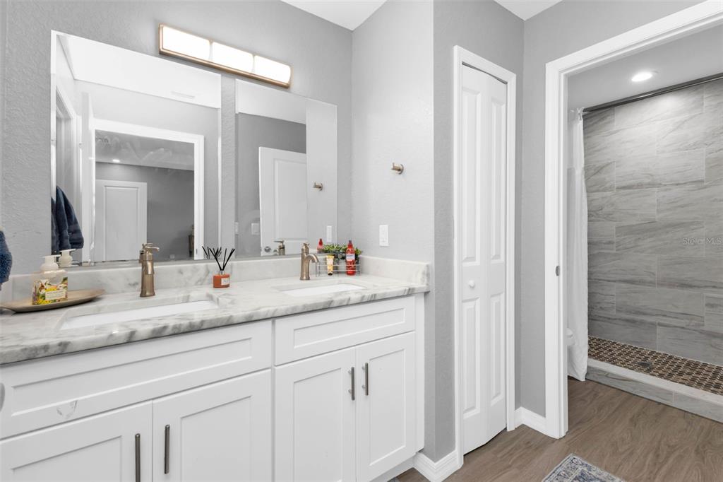 11615 Southwest Orange Avenue Arcadia, FL 34269 - Photo 16 of 27 a bathroom with a granite countertop sink and a mirror