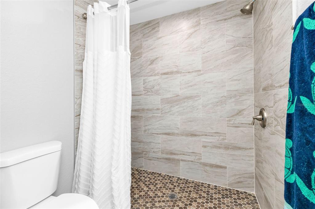 11615 Southwest Orange Avenue Arcadia, FL 34269 - Photo 17 of 27 a bathroom with a shower and a toilet