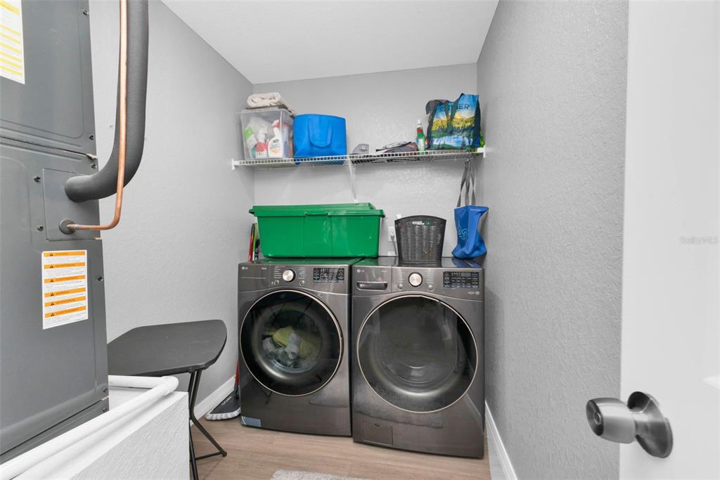 11615 Southwest Orange Avenue Arcadia, FL 34269 - Photo 19 of 27 a view of kitchen and washer and dryer