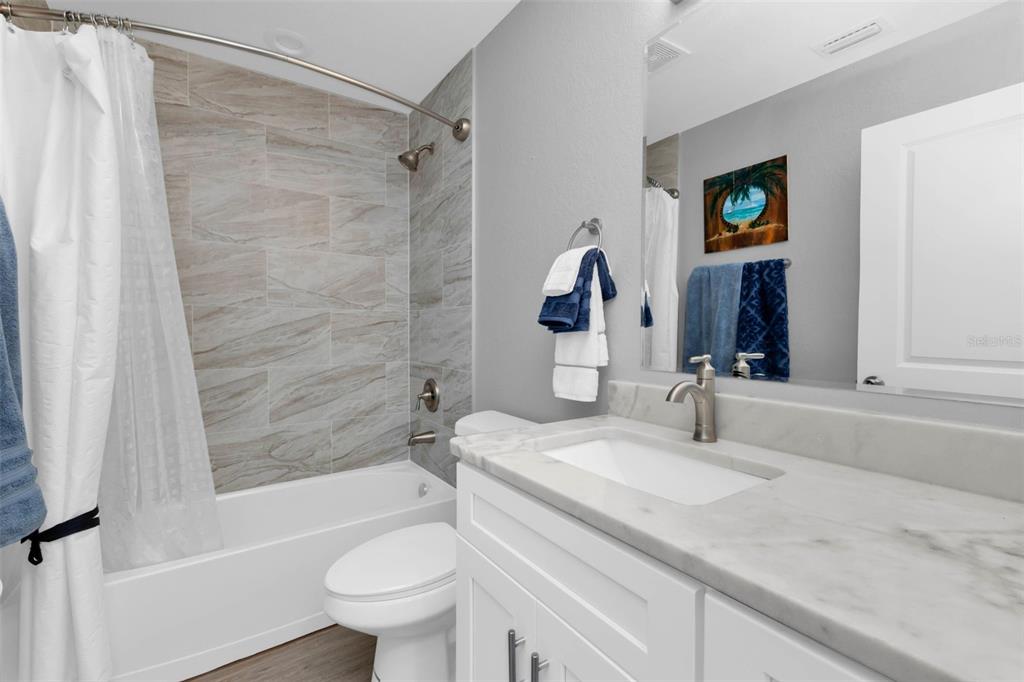 11615 Southwest Orange Avenue Arcadia, FL 34269 - Photo 22 of 27 a bathroom with a sink a toilet and shower