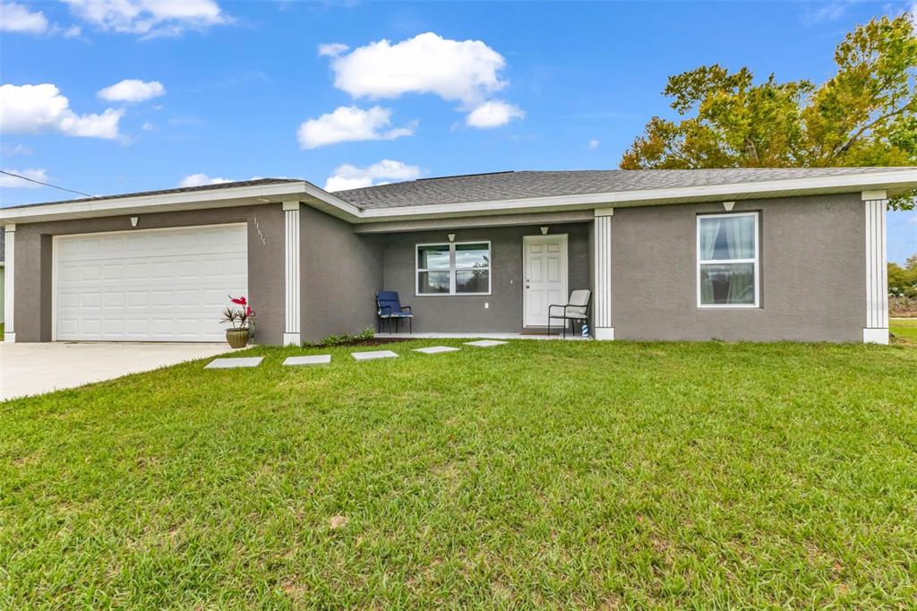 11615 Southwest Orange Avenue Arcadia, FL 34269 - Photo 24 of 27 a front view of house with yard and green space