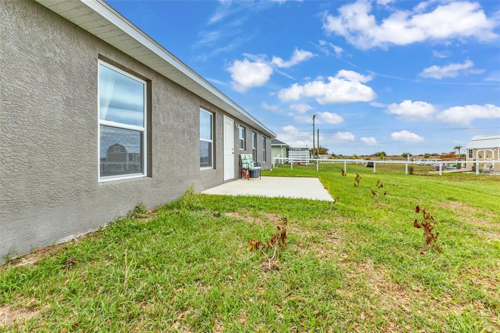 11615 Southwest Orange Avenue Arcadia, FL 34269 - Photo 25 of 27 a swimming pool with outdoor seating and yard
