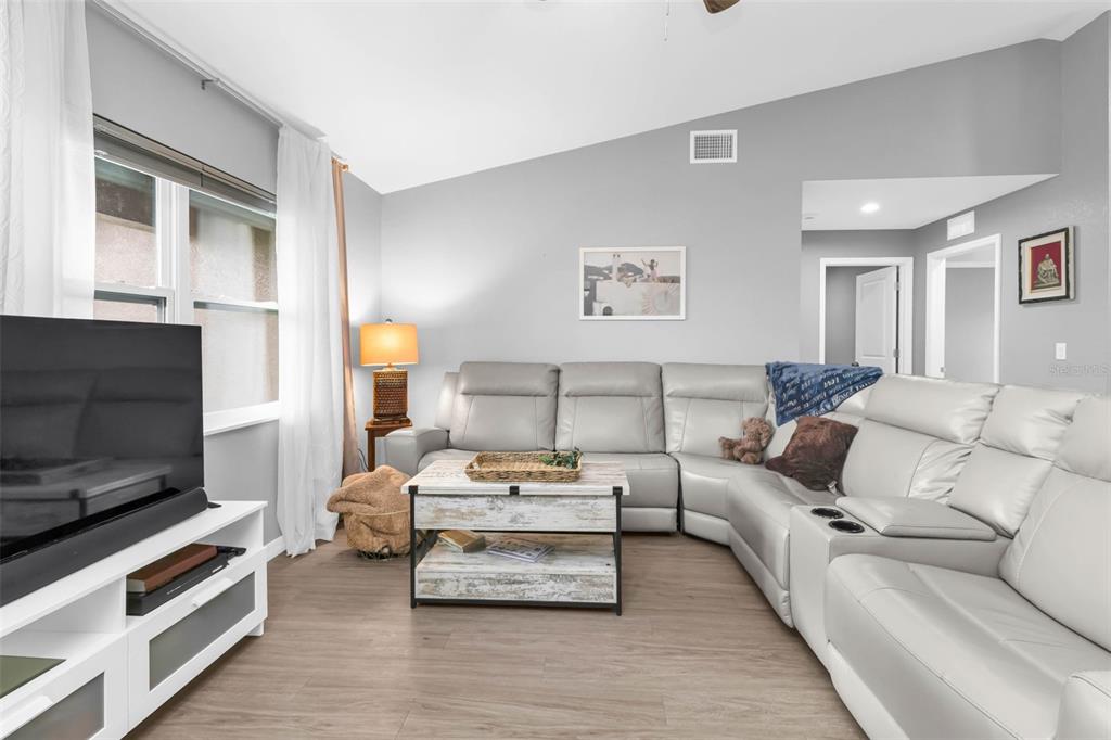 11615 Southwest Orange Avenue Arcadia, FL 34269 - Photo 5 of 27 a living room with furniture and a flat screen tv