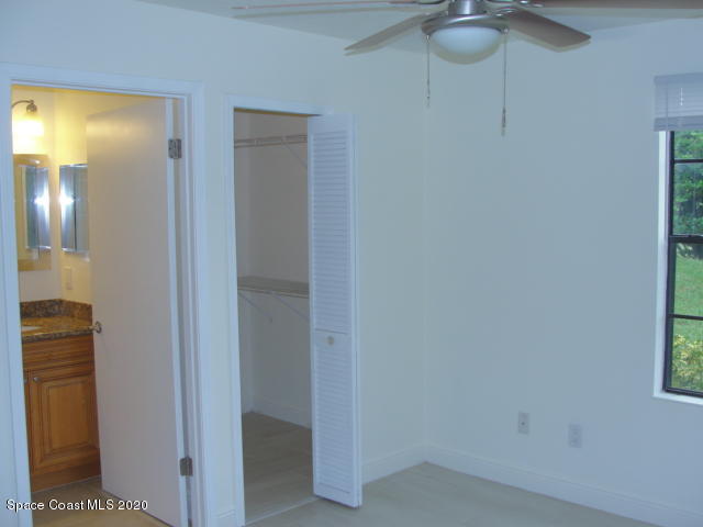 7667 North Wickham Road, Unit 1504 Melbourne, FL 32940 - Photo 24 of 27 Walk in closet and bath in Bedroom 2