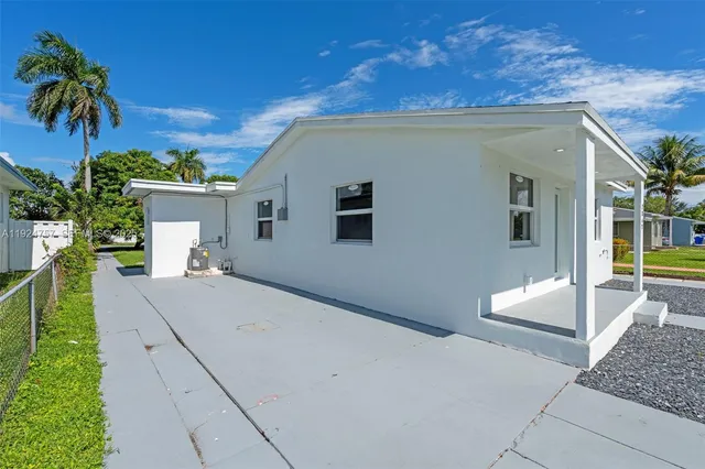 a house view with a backyard space