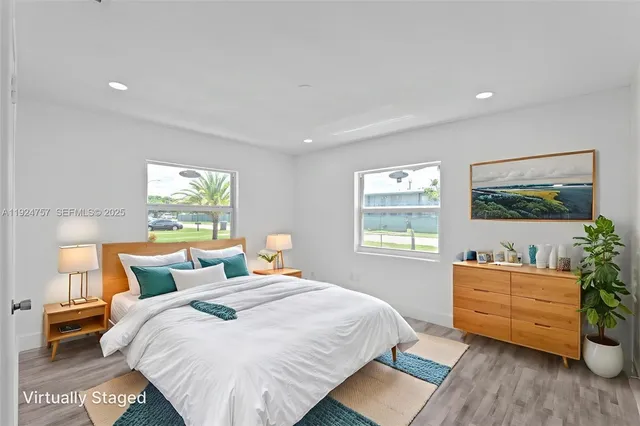 a bed room with a bed and windows