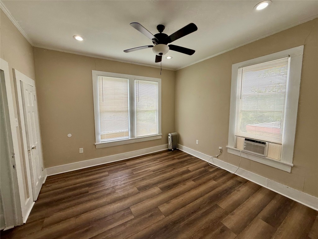 1403 14th Street, Unit 4 Huntsville, TX 77340 - Photo 9 of 9 wooden floor in an empty room with a window