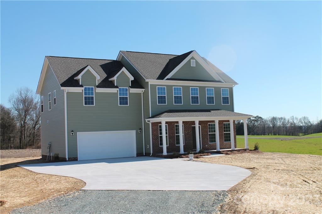 3220 Austin Chaney Road Monroe, NC 28110 - Photo 1 of 18 front view of a house with a yard