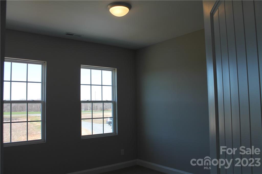 3220 Austin Chaney Road Monroe, NC 28110 - Photo 13 of 18 an empty room with windows