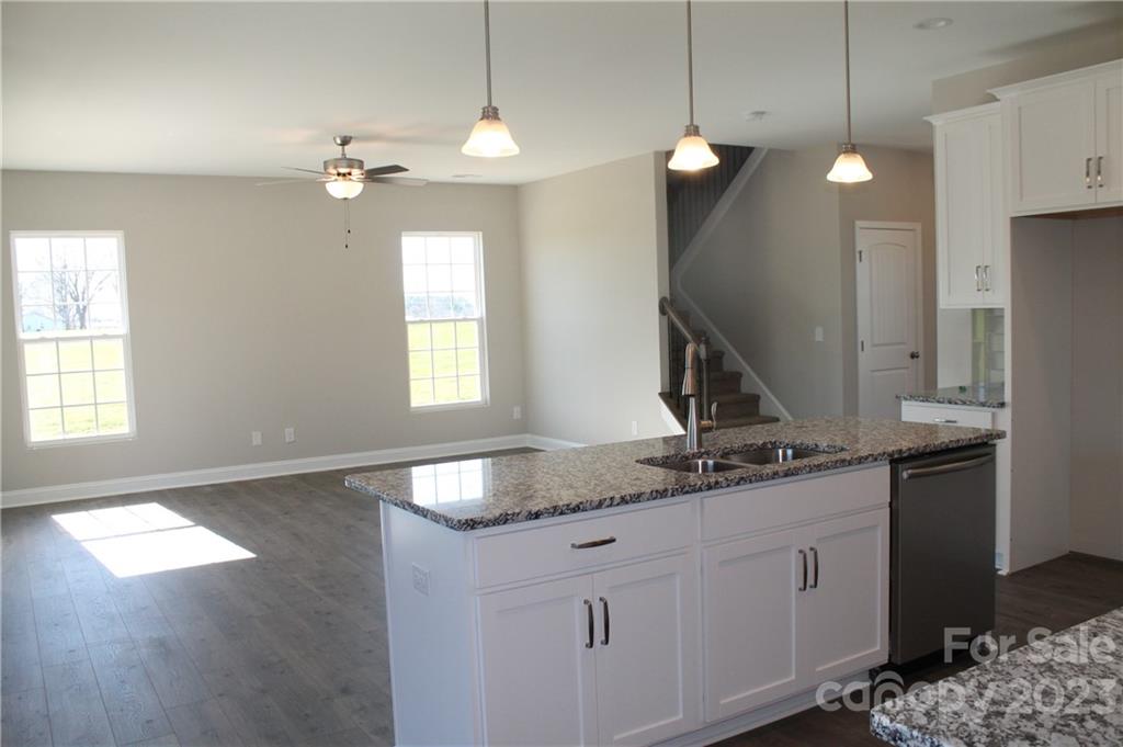 3220 Austin Chaney Road Monroe, NC 28110 - Photo 8 of 18 a kitchen with a sink granite counter top a stove and a window