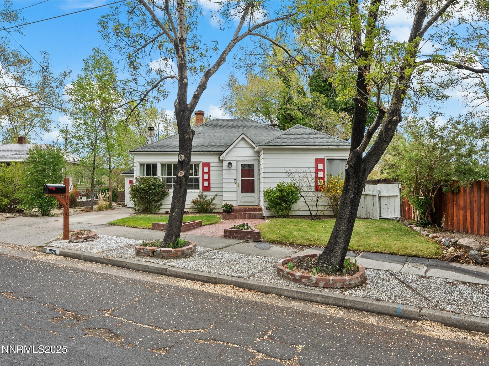 a house with tree in front of it