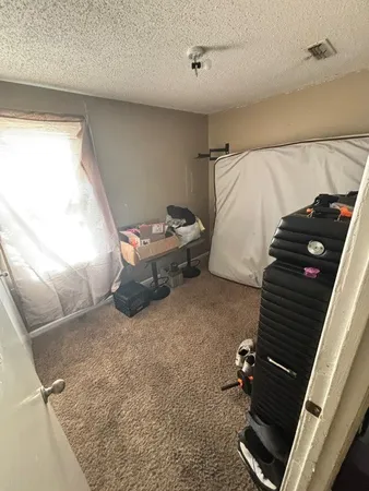 a living room with couches chairs and a flat screen tv