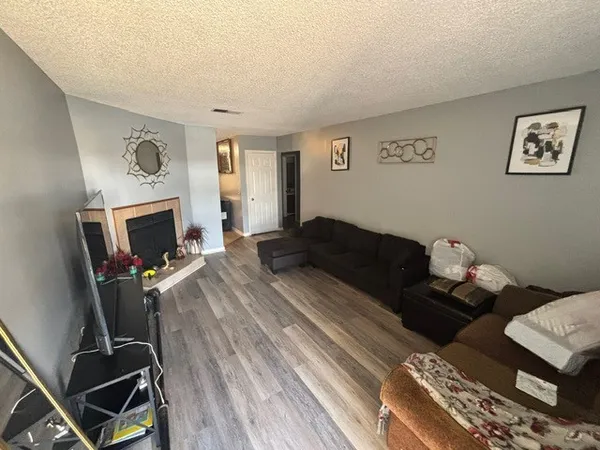 a bedroom with a bed and lamp