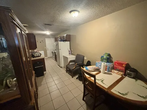 a kitchen with a sink appliances and cabinets