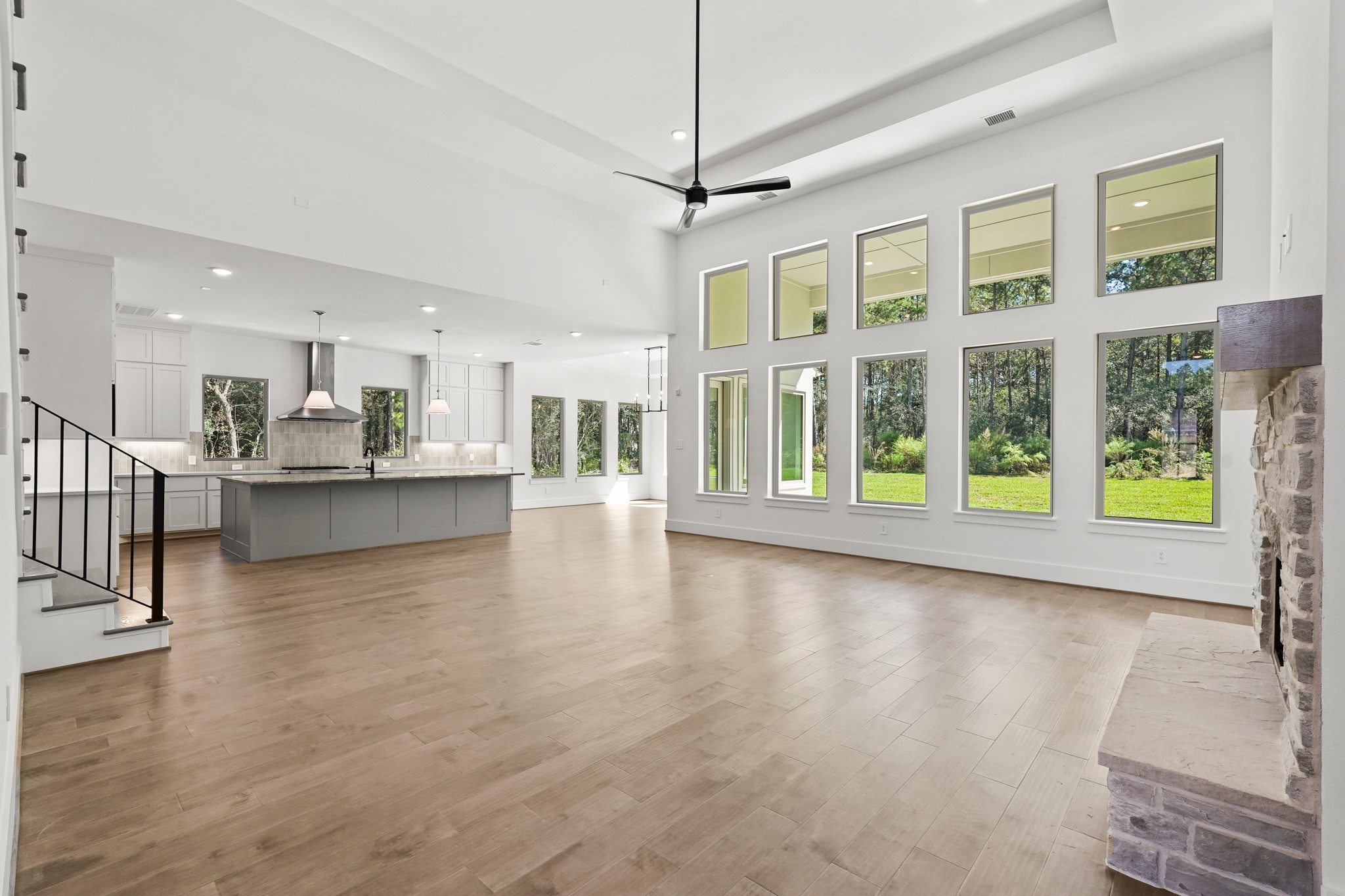 24919 Balmorhea Way Montgomery, TX 77316 - Photo 14 of 36 a view of a living room and kitchen with a large window