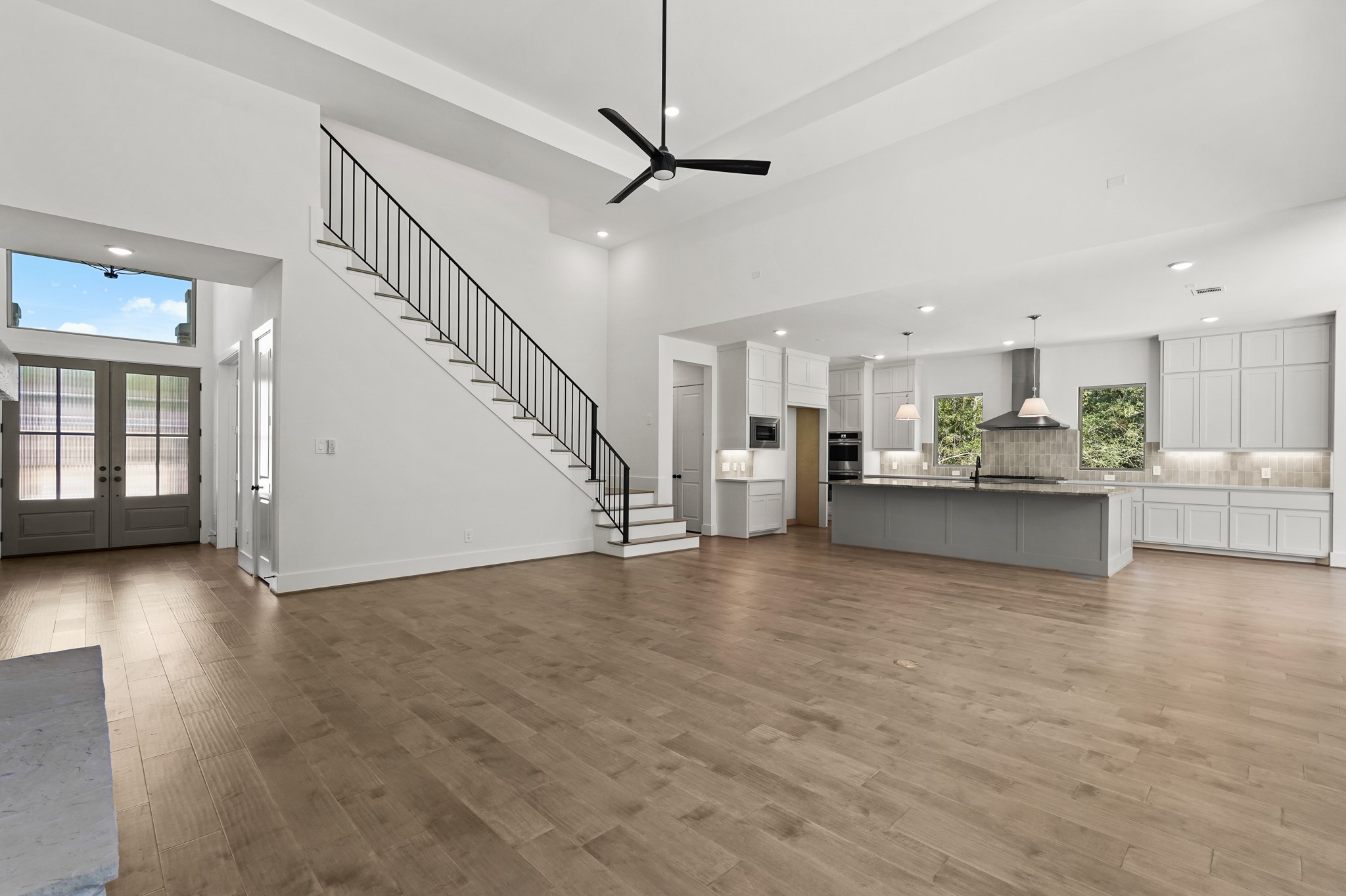 24919 Balmorhea Way Montgomery, TX 77316 - Photo 15 of 36 a view of kitchen and hall with wooden floor