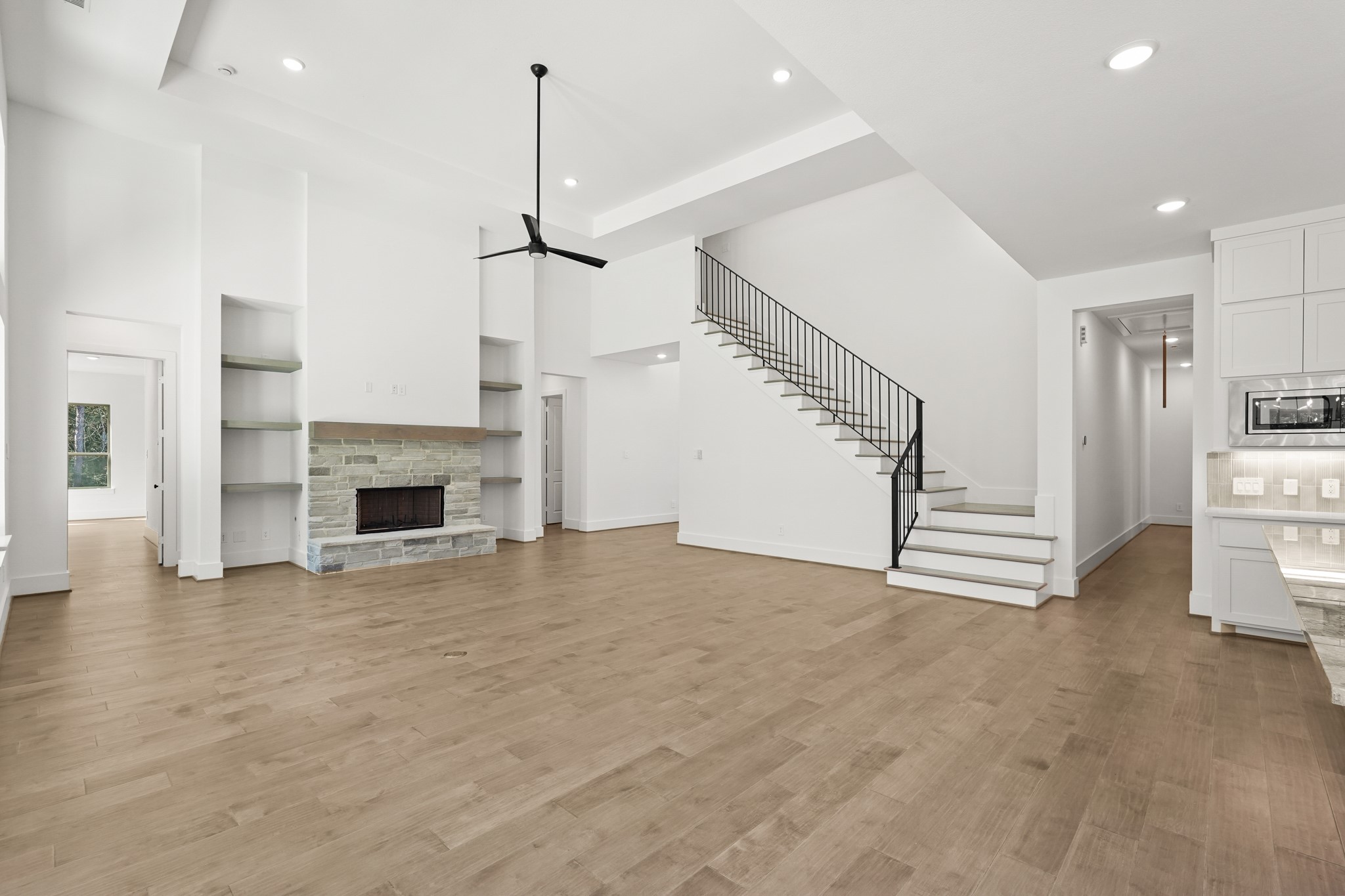 24919 Balmorhea Way Montgomery, TX 77316 - Photo 16 of 36 a view of a kitchen with furniture and a fireplace