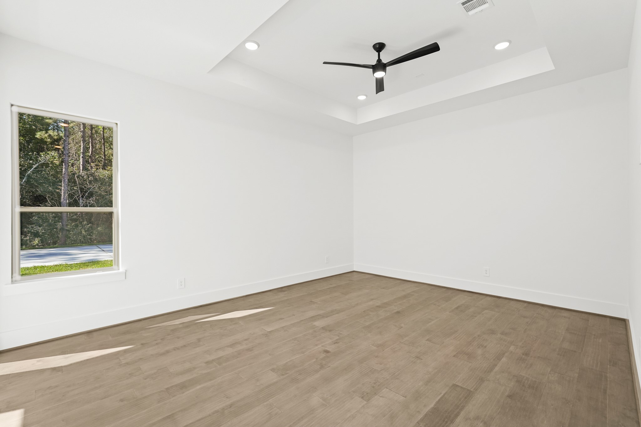24919 Balmorhea Way Montgomery, TX 77316 - Photo 22 of 36 an empty room with a window and a ceiling fan