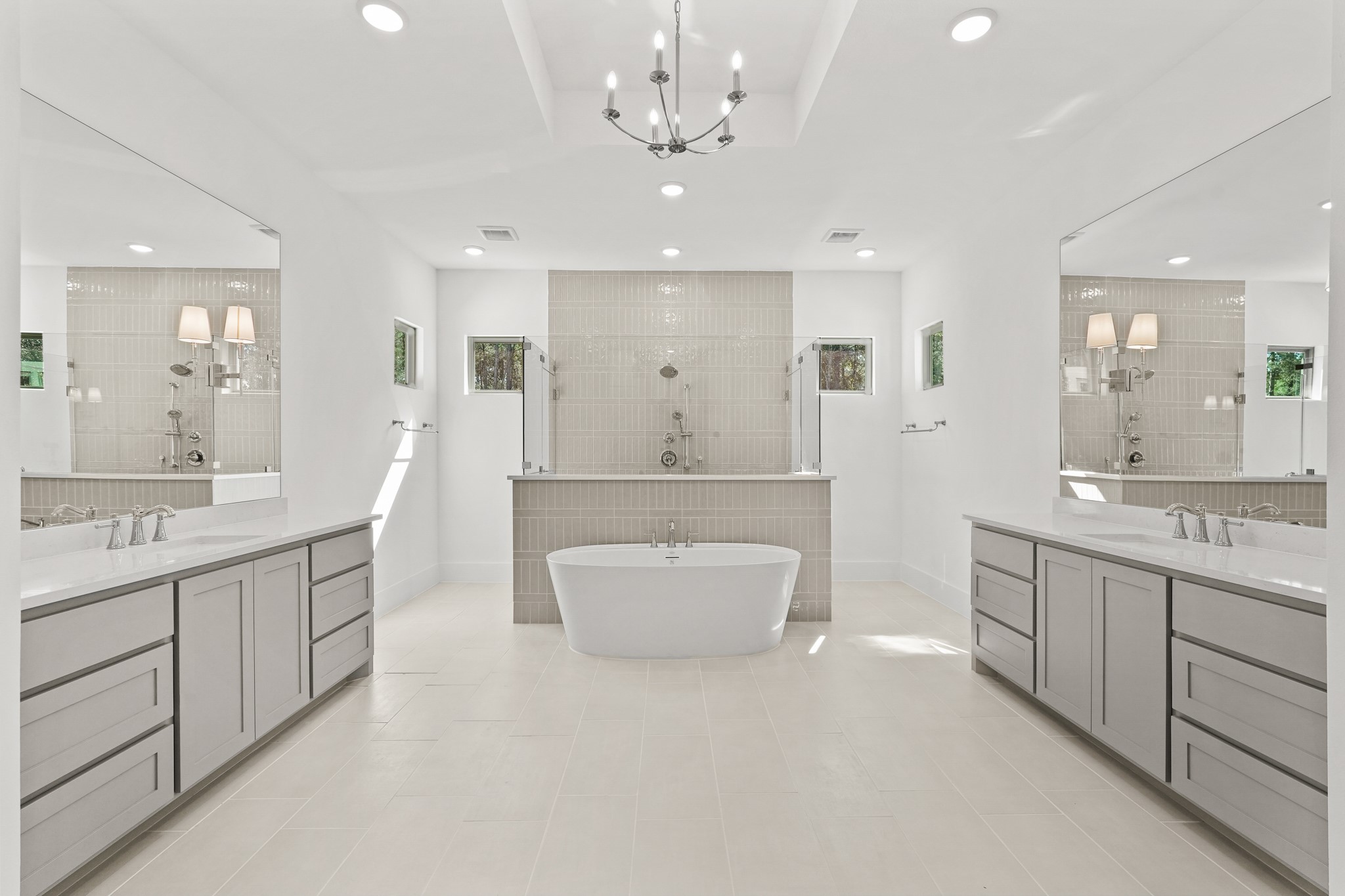 24919 Balmorhea Way Montgomery, TX 77316 - Photo 23 of 36 a bathroom with a double vanity sink mirror and bathtub