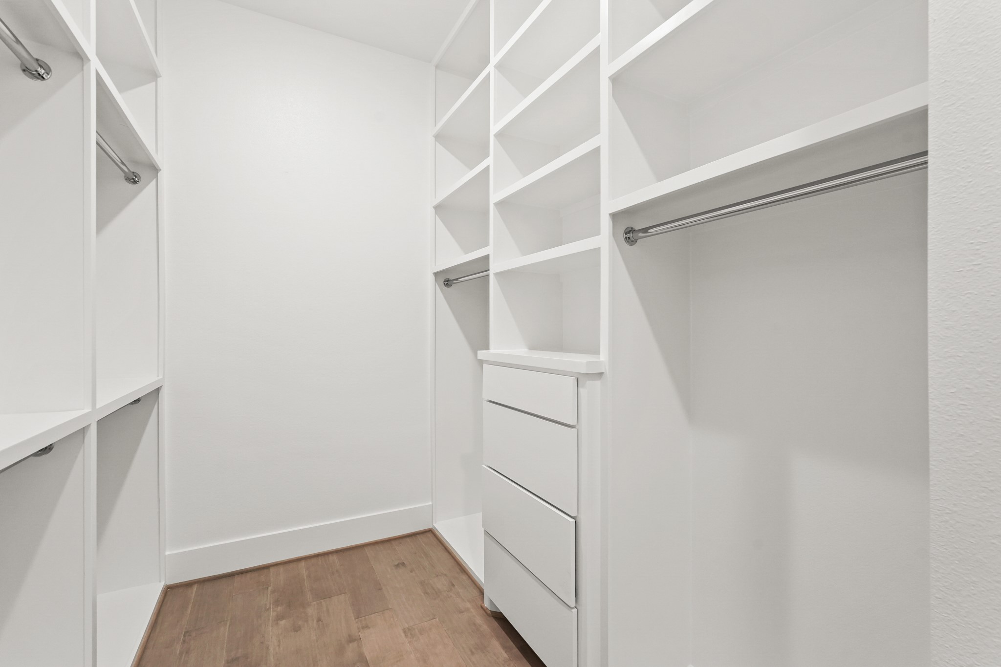 24919 Balmorhea Way Montgomery, TX 77316 - Photo 27 of 36 a view of walk in closet with empty racks