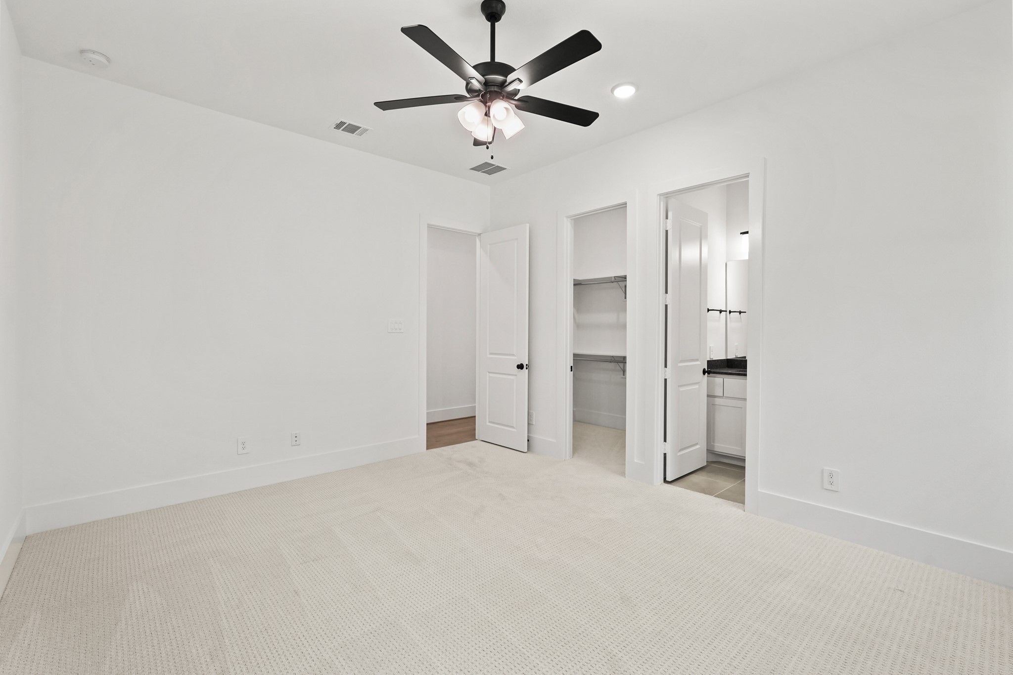 24919 Balmorhea Way Montgomery, TX 77316 - Photo 29 of 36 an empty room with closet and windows
