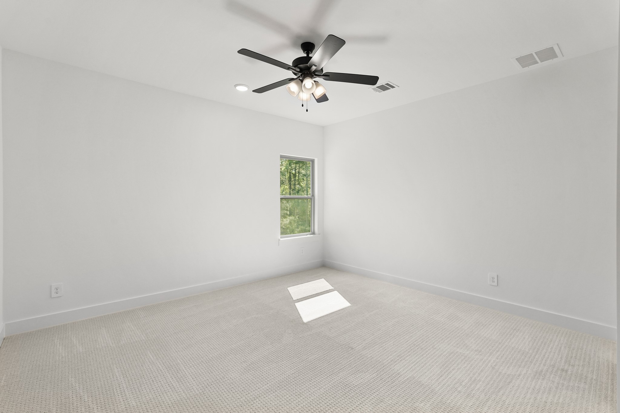 24919 Balmorhea Way Montgomery, TX 77316 - Photo 34 of 36 an empty room with windows and fan