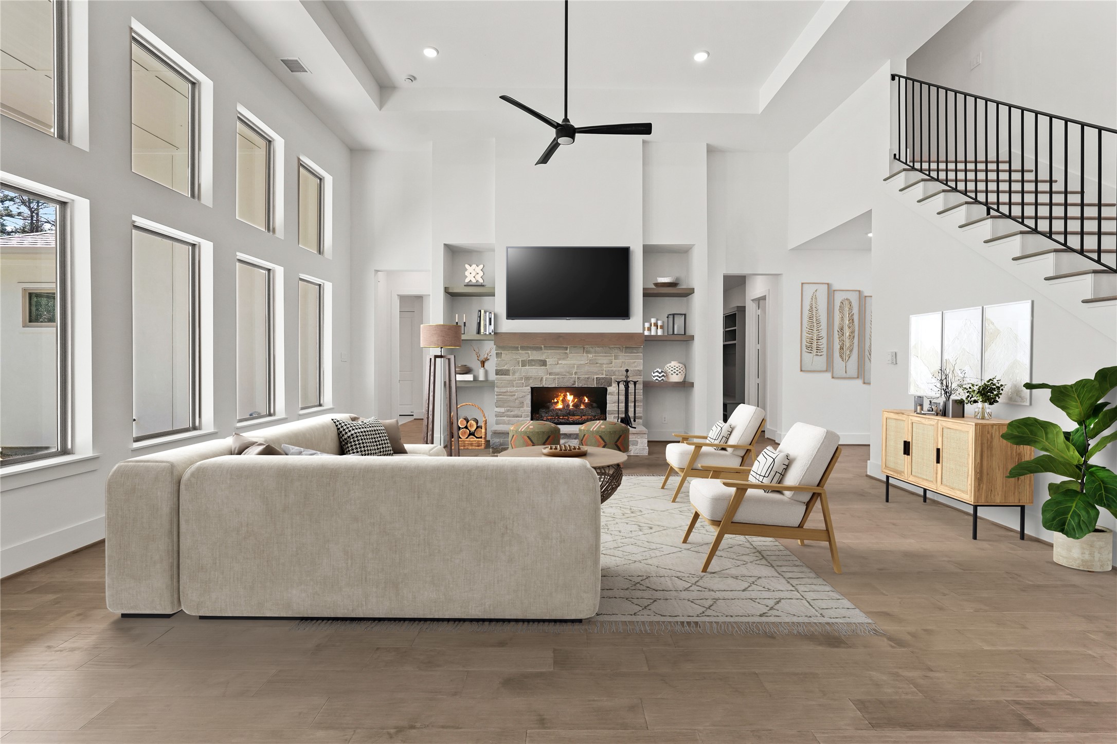 24919 Balmorhea Way Montgomery, TX 77316 - Photo 8 of 36 a living room with furniture a flat screen tv and a fireplace