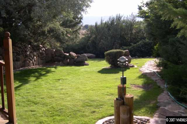 1630 Star Way Reno, NV 89511 - Photo 7 of 9 a swimming pool with some trees in the background