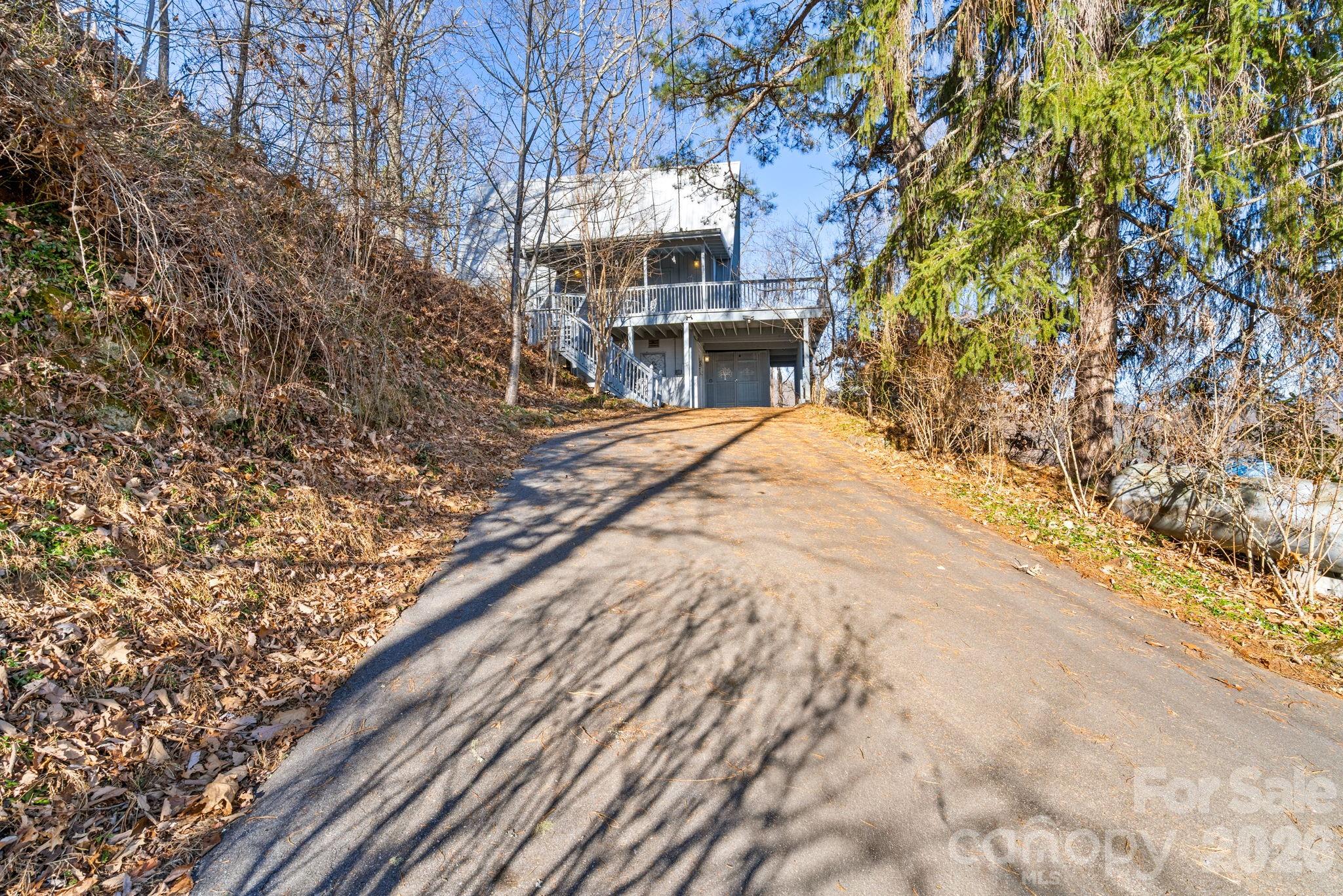 889 Big Ridge Road Franklin, NC 28734 - Photo 28 of 32 a front view of a house with a yard
