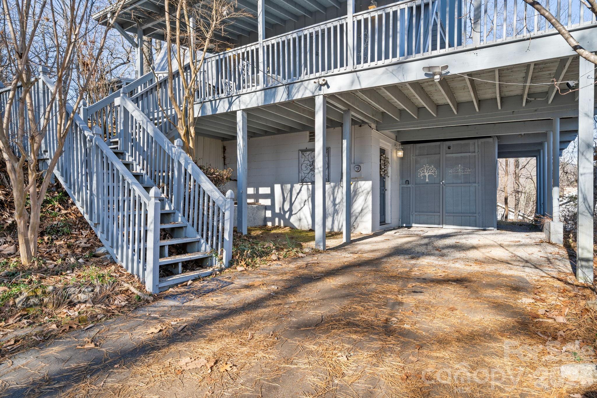 889 Big Ridge Road Franklin, NC 28734 - Photo 30 of 32 a view of a house with backyard and deck