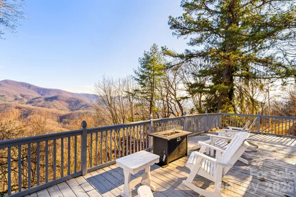 a view of a chairs and table on the deck