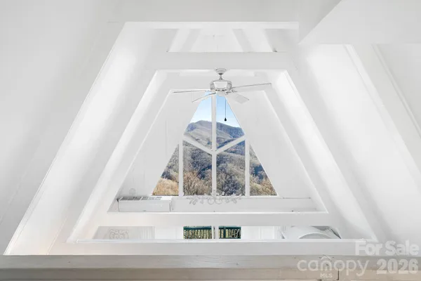 a view of staircase with a white door