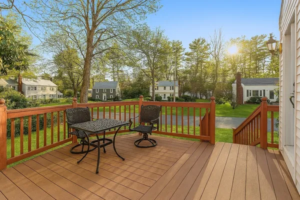 a view of balcony with wooden floor and outdoor seating