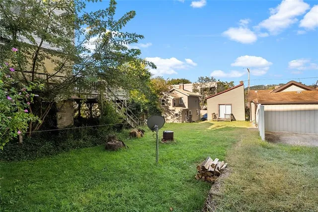a backyard of a house with lots of green space
