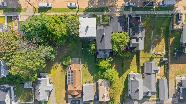 an aerial view of residential houses and trees